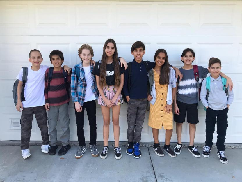 Eight children on their first day of eighth grade.