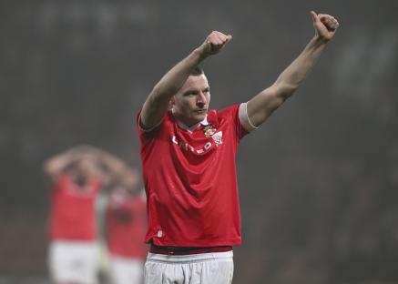 Paul Mullin of Wrexham gives a thumbs-up to fans.