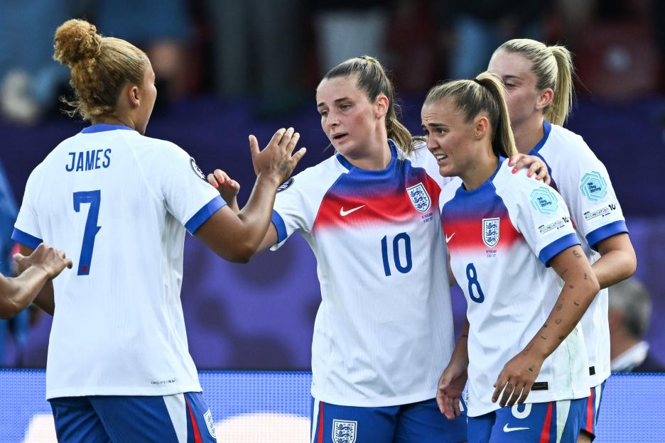 England's Georgia Stanway, Lauren James, and Ella Toone celebrating a goal.