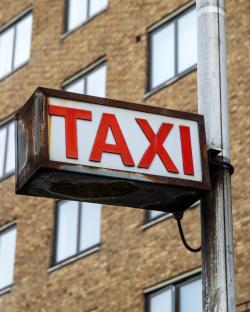 Rusty taxi sign in London.