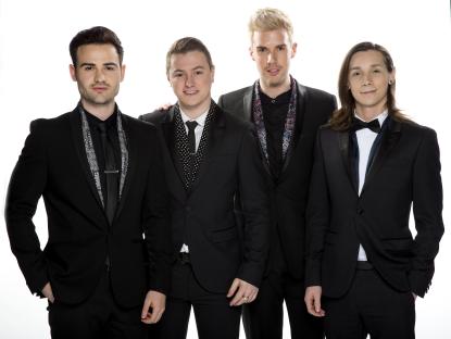 Four men in black suits.