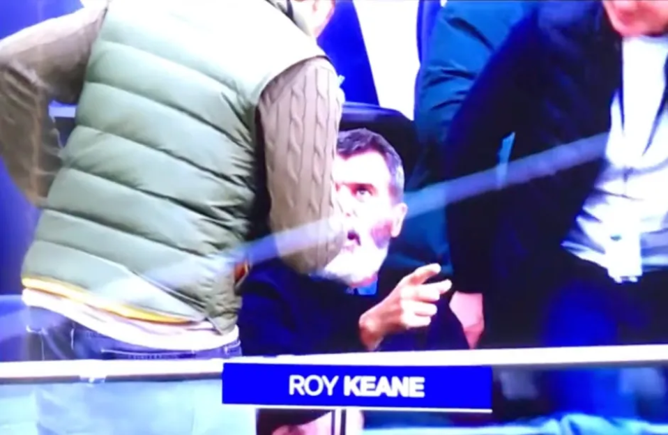 Roy Keane reacting angrily.