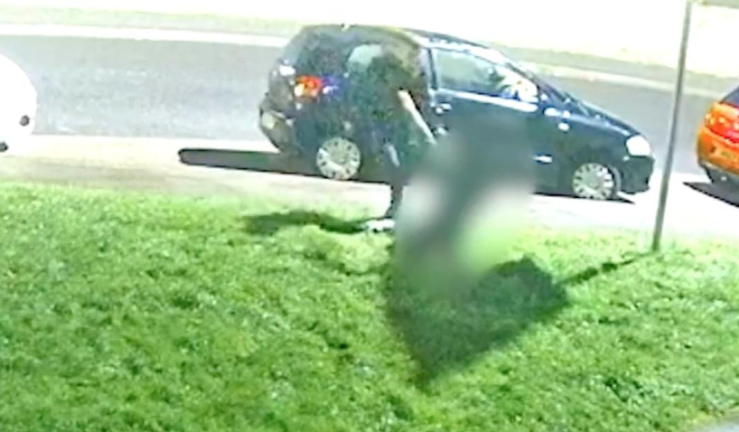 Blurred CCTV image of a machete attack.