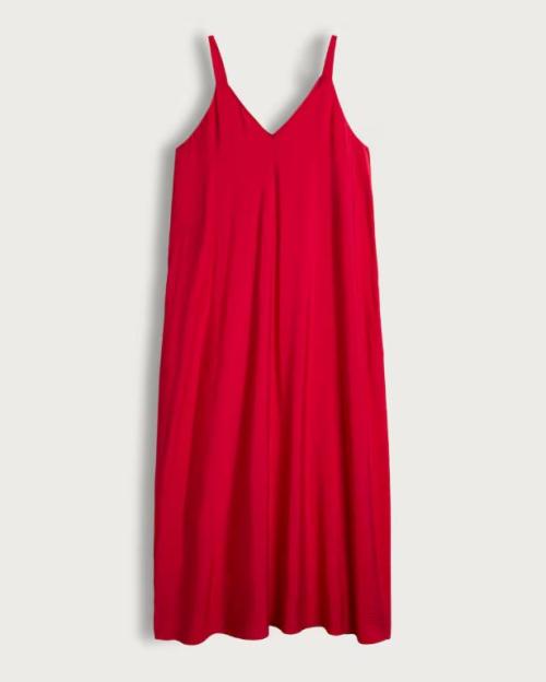Red maxi dress with thin straps.