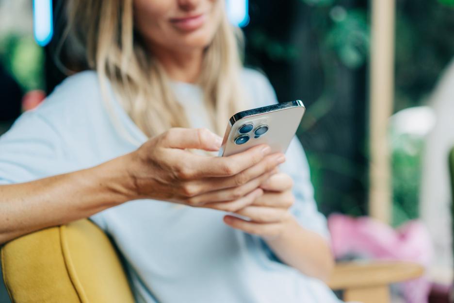 Close-up of a woman's hands holding a smartphone.