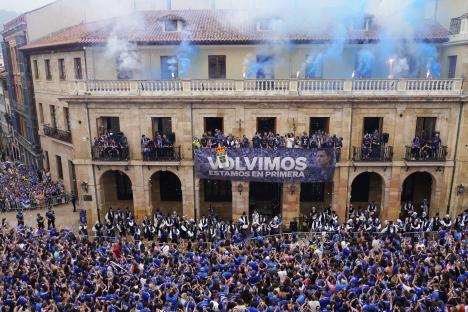 Real Oviedo players celebrating promotion with fans.