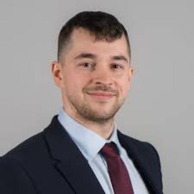 Headshot of Dr. Ross Nieuwoudt.