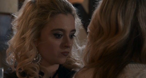 Screenshot of two women facing each other.