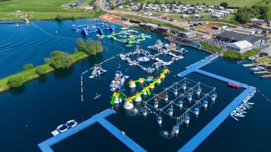 Aerial view of an aqua park on a lake.