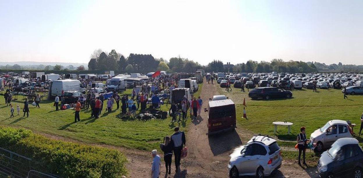 Car boot sale on a large farm.