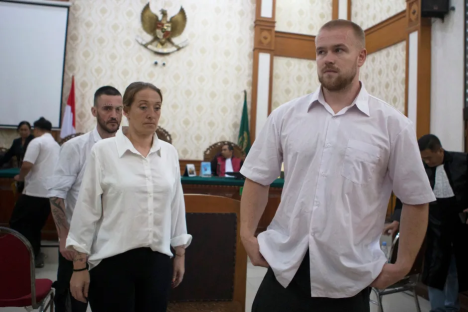 Two defendants in a courtroom.