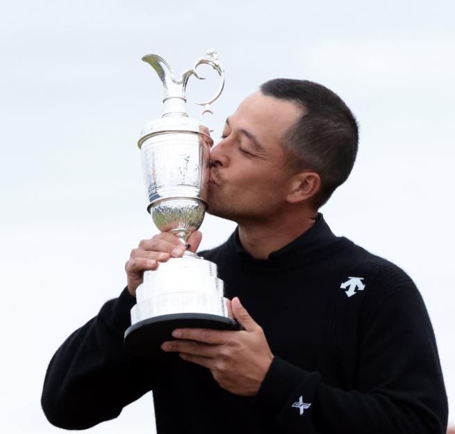 Xander Schauffele kissing the Claret Jug after winning the Open Championship.