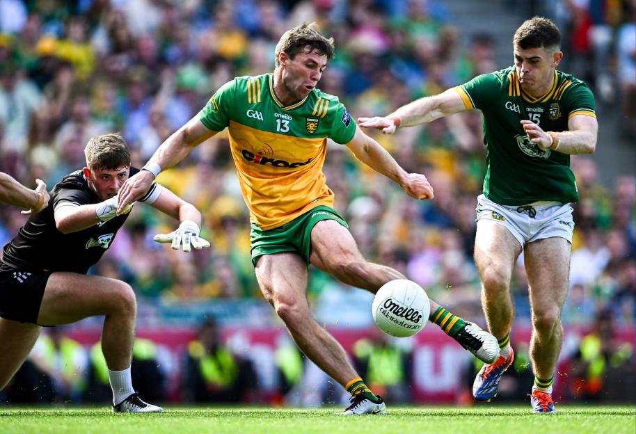 13 July 2025; Conor O'Donnell of Donegal scores his side's third goal under pressure from Meath goalkeeper Billy Hogan and Eoghan Frayne of Meath during the GAA Football All-Ireland Senior Championship semi-final match between Meath and Donegal at Croke Park in Dublin. Photo by Piaras à MÃdheach/Sportsfile