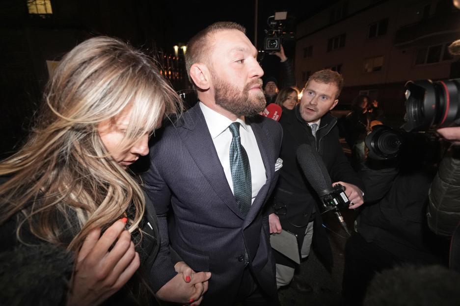 Conor McGregor and Dee Devlin leaving Dublin's High Court after a personal injury trial.
