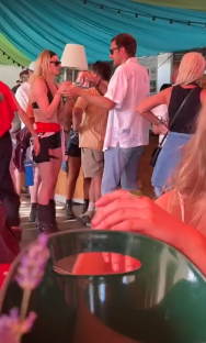 People socializing at an outdoor event.