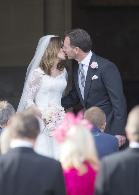 Bride and groom kissing after wedding ceremony.