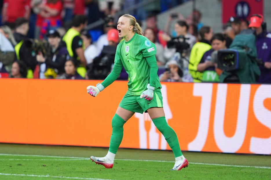 Hannah Hampton of England celebrates after saving a penalty kick during a soccer match.