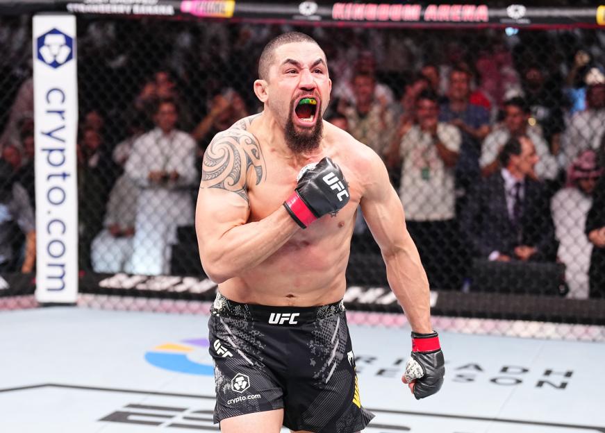 Robert Whittaker celebrates his UFC victory.