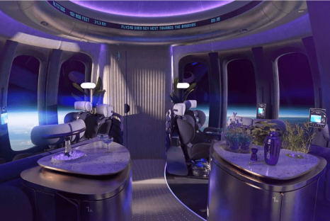 Illustration of a spaceship interior with seating and small tables.