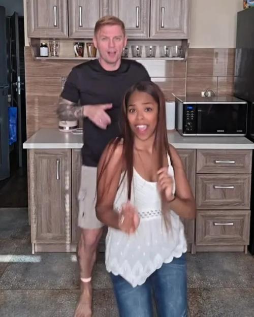 Couple in kitchen, six years after defying age gap criticism.
