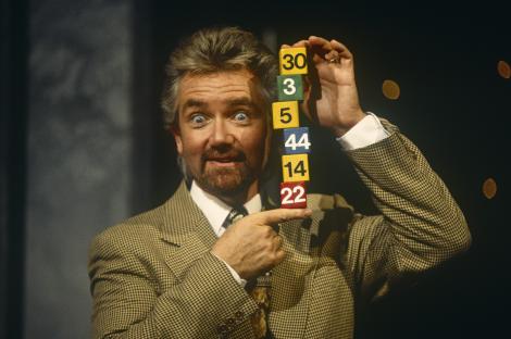 Noel Edmonds and his wife Liz Davies stand outside a pub.