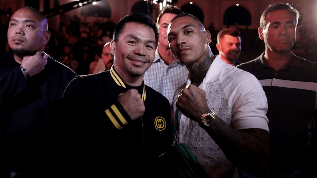Manny Pacquiao and another boxer posing for a photo.