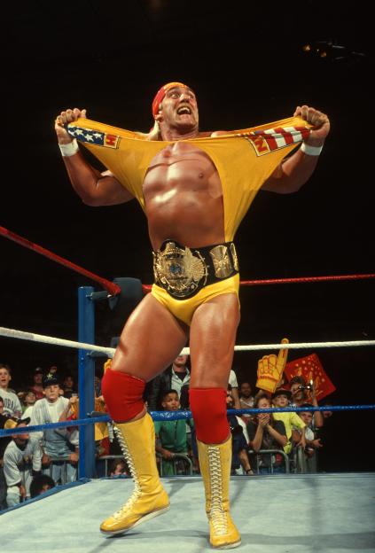 Hulk Hogan in a wrestling ring, ripping off his shirt.