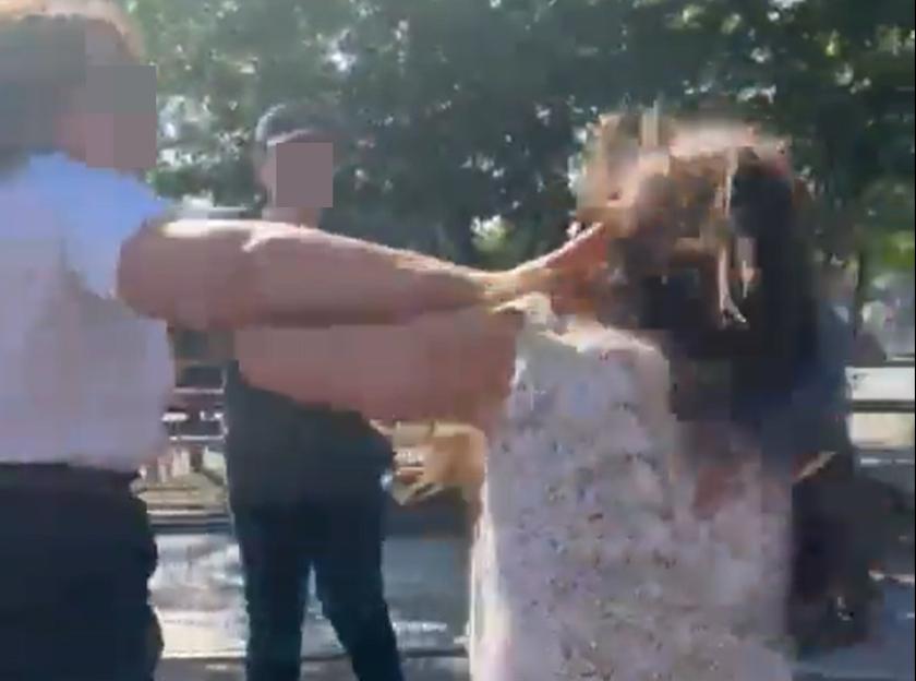 A McDonald's employee slapping a customer during a fight outside the restaurant.