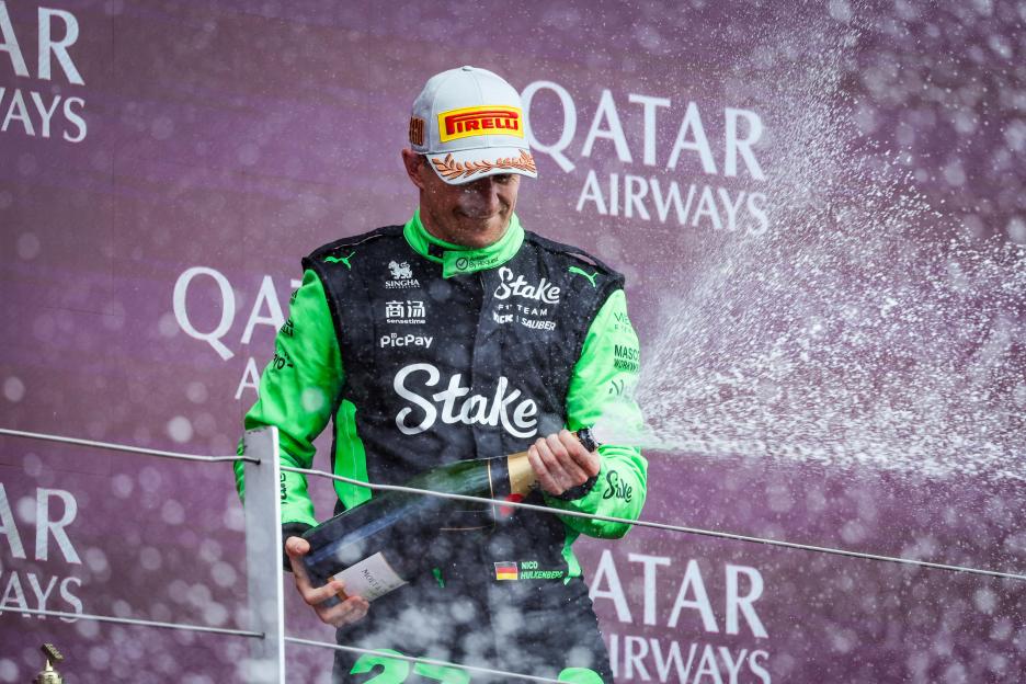 Nico Hulkenberg spraying champagne on the podium.