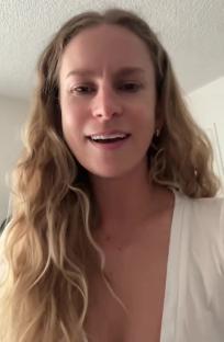 Woman with long blonde hair talking to the camera.