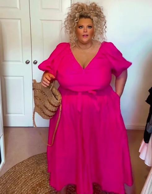 Woman in a pink dress.
