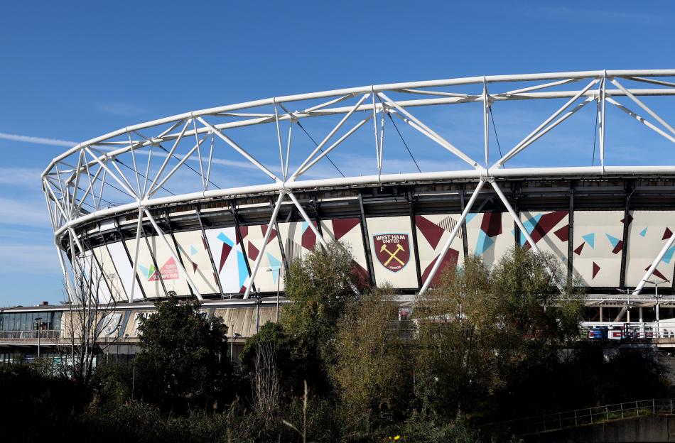 Exterior view of the London Stadium, showing the West Ham United F.C. logo.