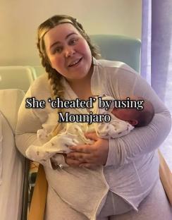Woman holding a newborn baby.
