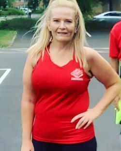 Woman in red tank top.