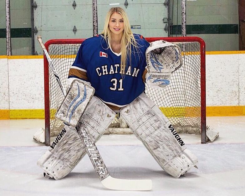 a hockey goalie with the number 31 on her jersey