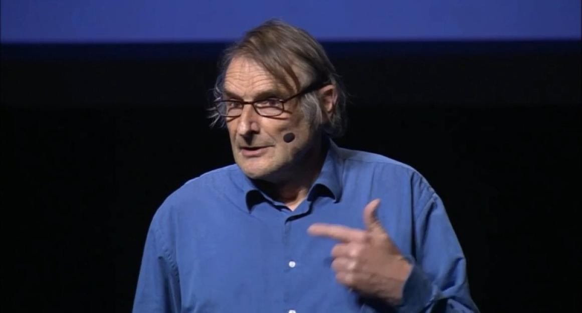 Richard Gill speaking at a conference.
