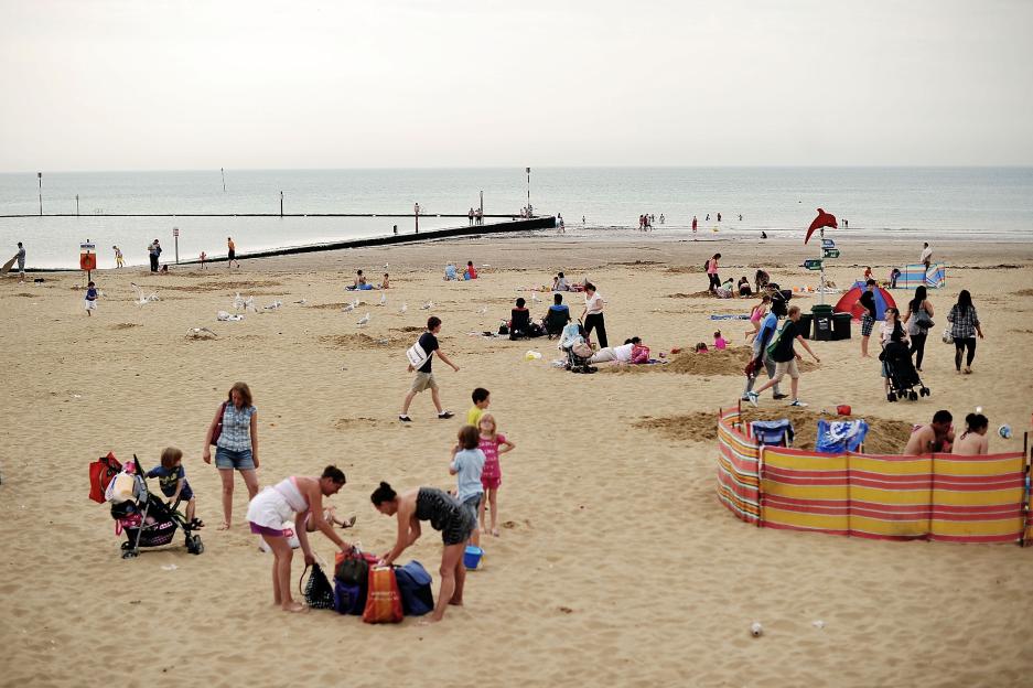 Margate beach with many people enjoying a sunny day.