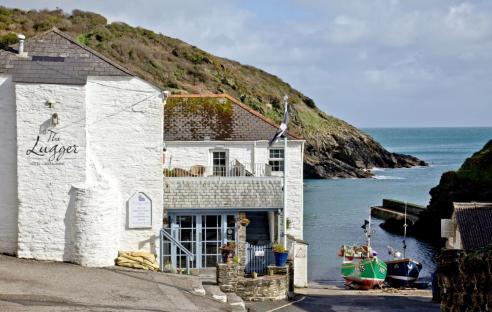 The Lugger Hotel and Restaurant overlooking a cove in Cornwall.