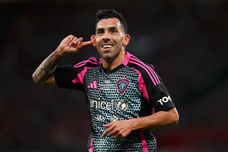 Carlos Tevez celebrating after scoring a goal.