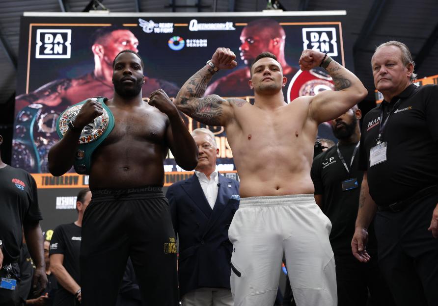 Oleksandr Usyk and Daniel Dubois at a boxing weigh-in.