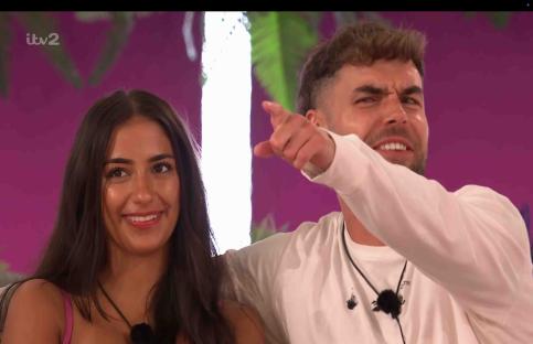 Love Island contestants playing a game.