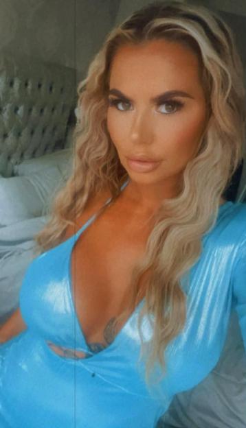 Coleen Campbell in a light blue dress.