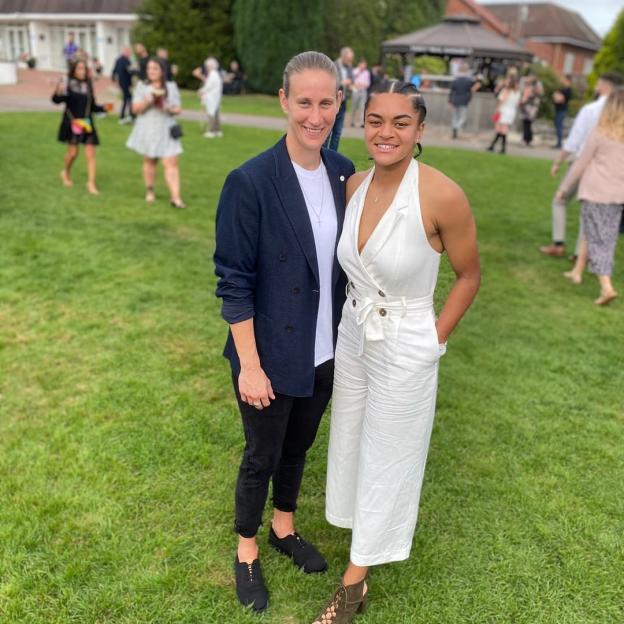 Jess Carter and Ann-Katrin Berger at an outdoor event.