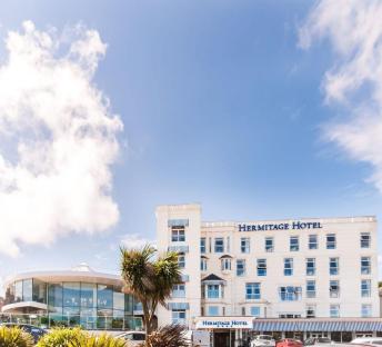Hermitage Hotel in front of a bright blue sky.