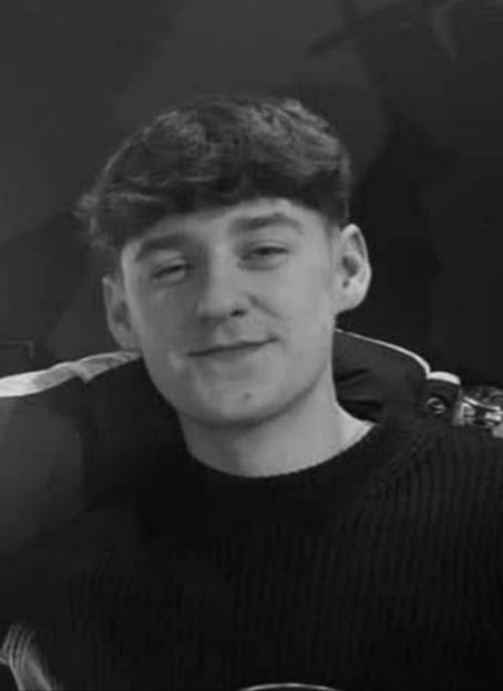 Black and white photo of a young man.