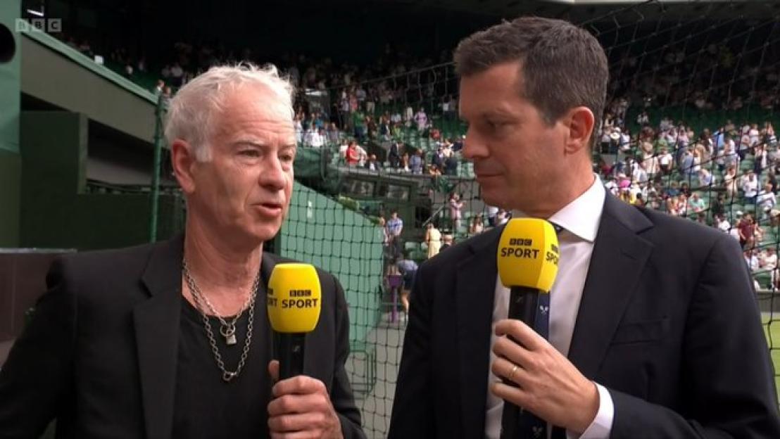 Two men being interviewed at Wimbledon.