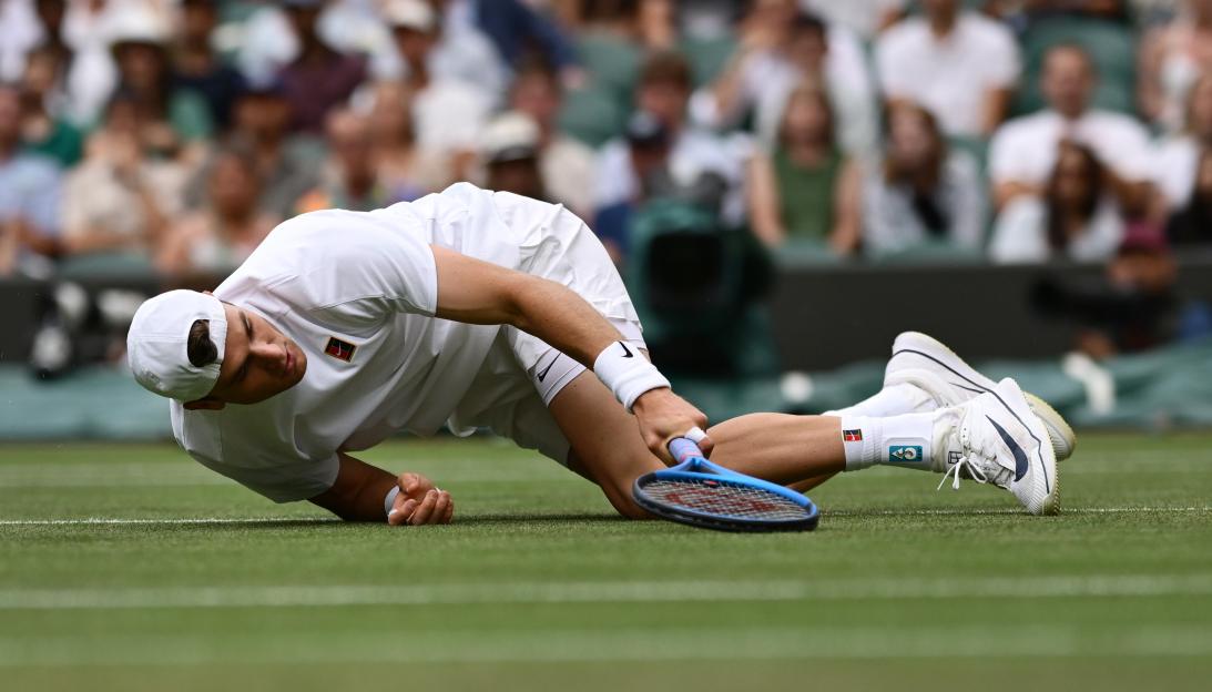 Jack Draper of Great Britain falls during a tennis match.