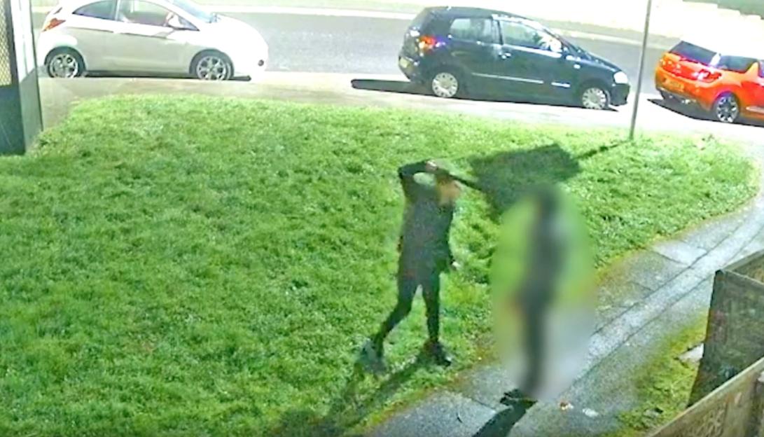 CCTV image of a person wielding a machete during an assault.