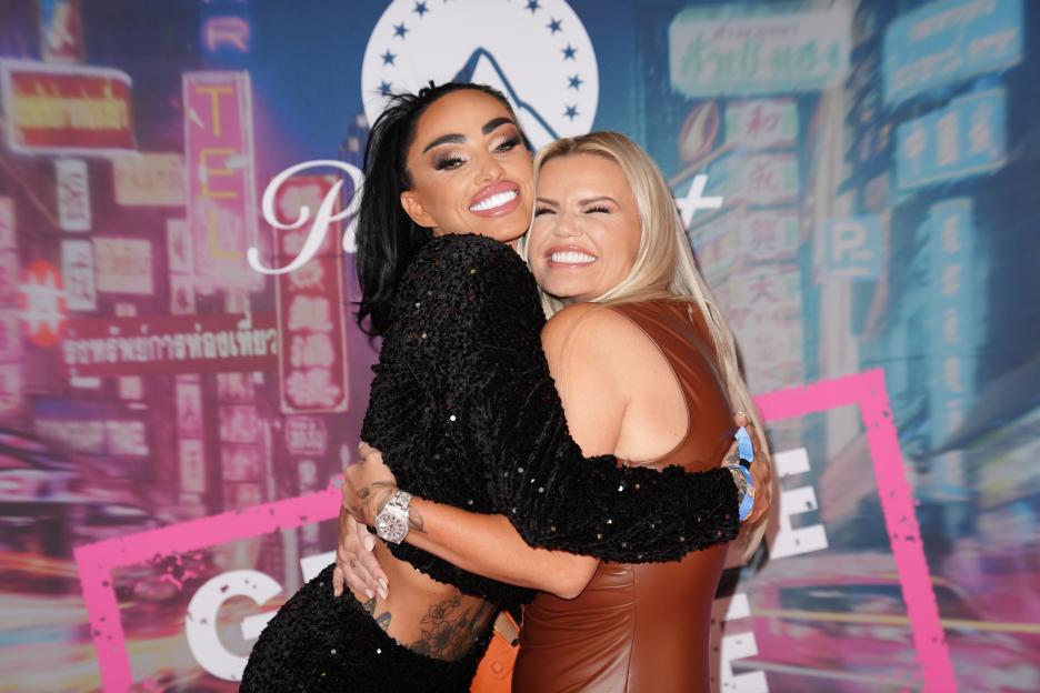 Katie Price and Kerry Katona hugging at a party.