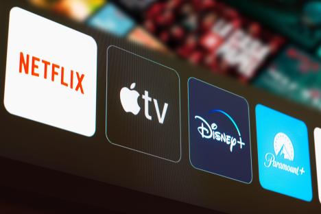 Netflix, Apple TV, Disney+, and Paramount+ logos on a TV screen.